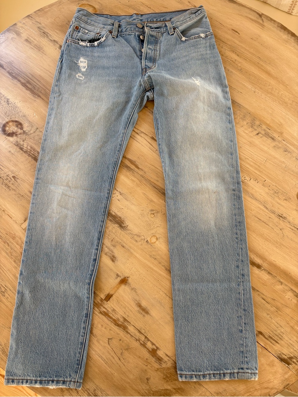 Levi's Light Blue Straight Jeans with Subtle Distressing